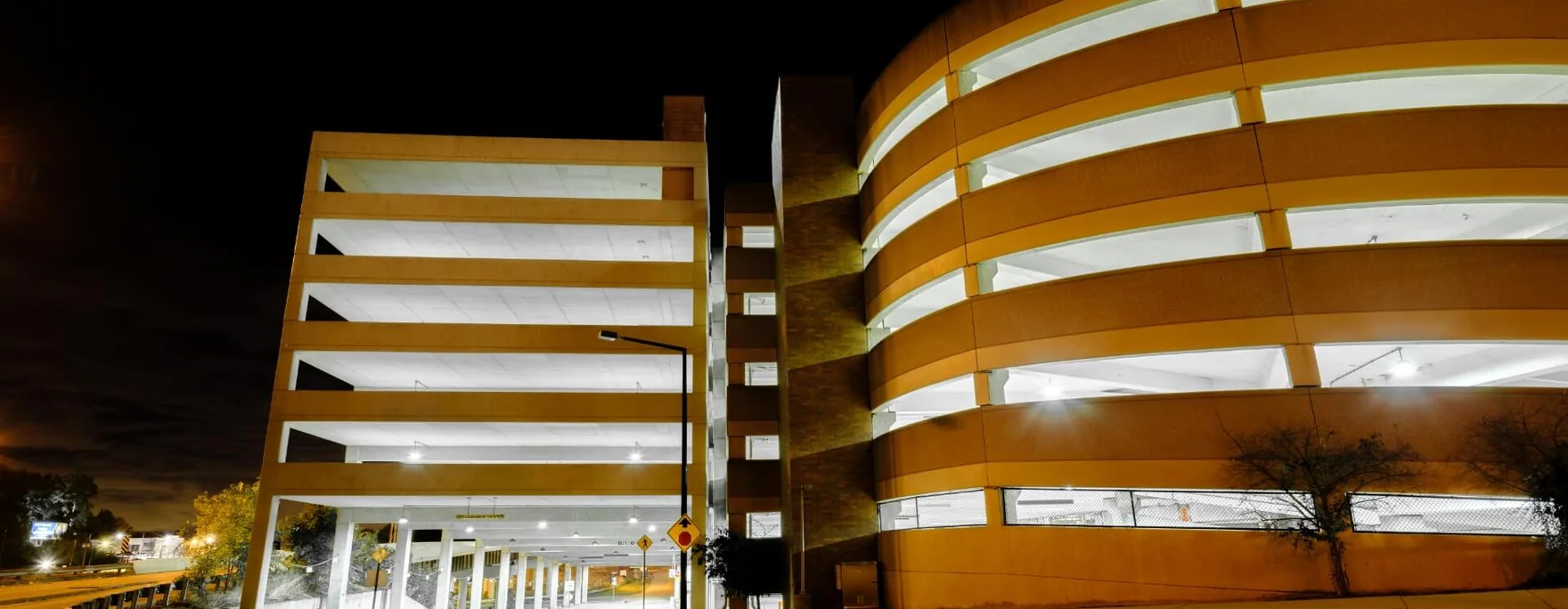 Multi-storey parking structure lit at night